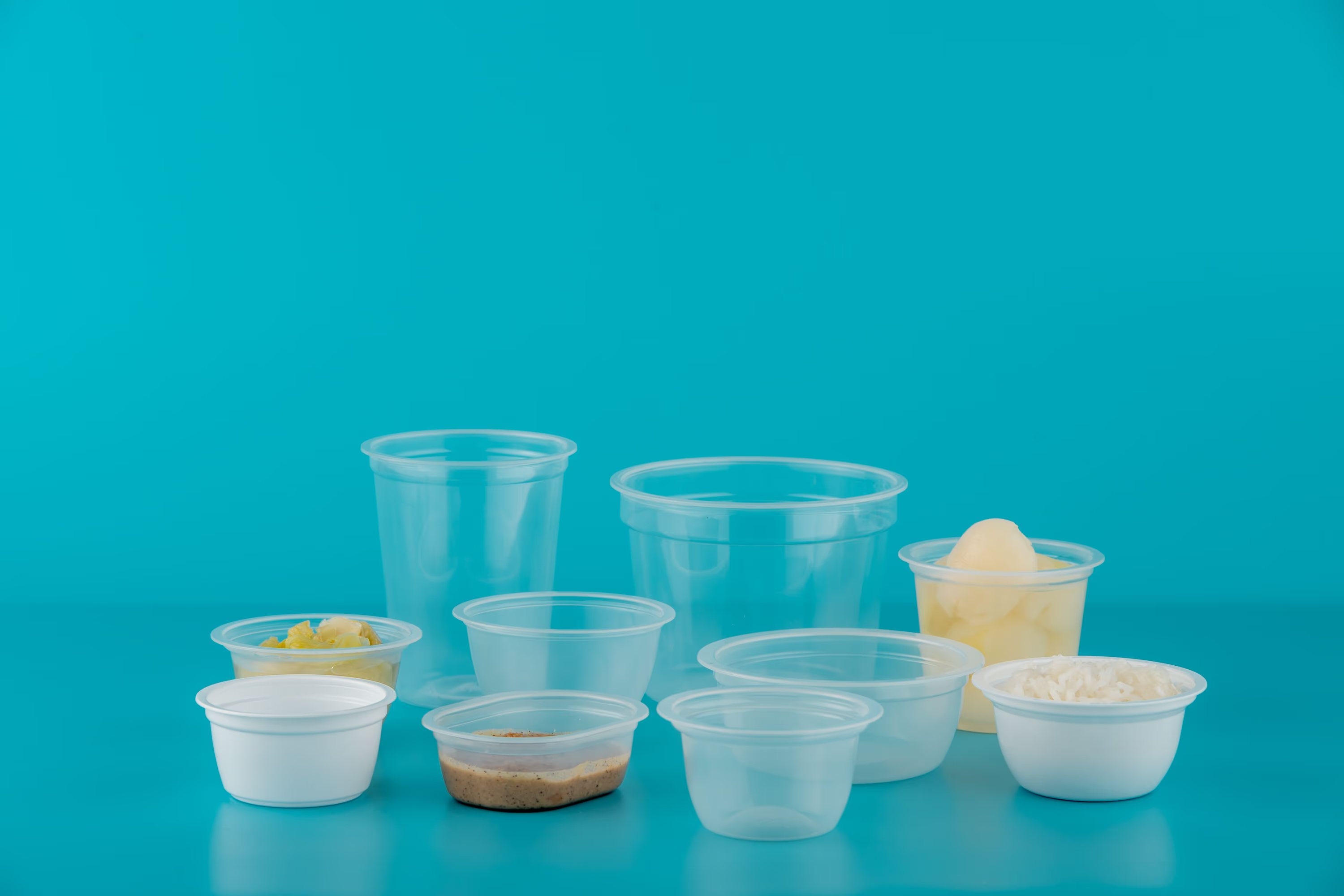 Thermoformed cups made from multilayer plastic sheets with high barrier properties to help protect against oxygen and moisture.